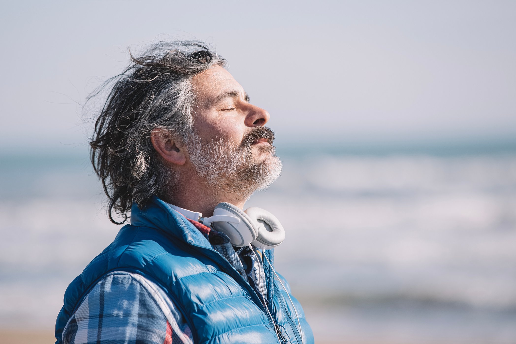 A man on the beach. relaxing deep breathing.